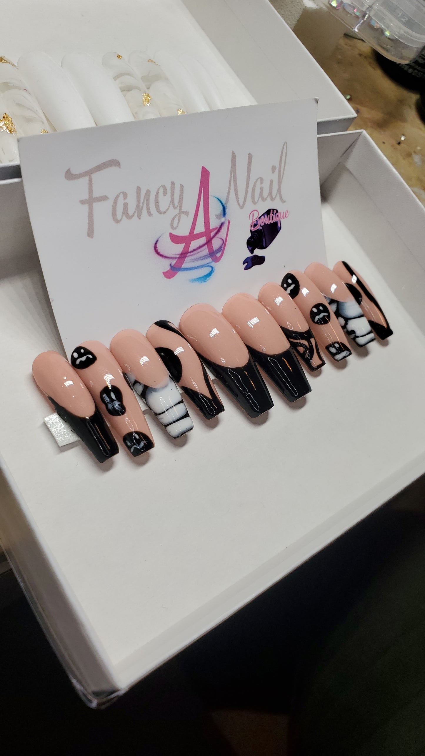 Black french tip nails with designs